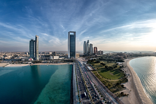 Aerial view of roads and beaches in Abu Dhabi, UAE. Luxury hotel is also visible.