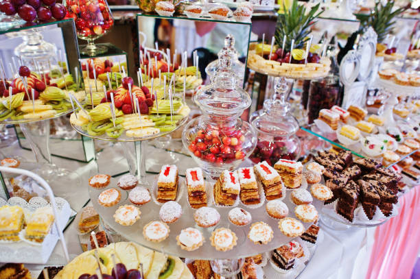istock Wedding reception table with different fruits, cakes and sweets. 656179336
