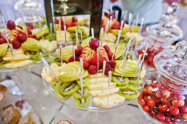 istock Wedding reception table with different fruits, cakes and sweets. 656179402