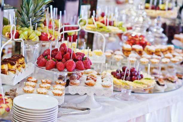 istock Wedding reception table with different fruits, cakes and sweets 656179606