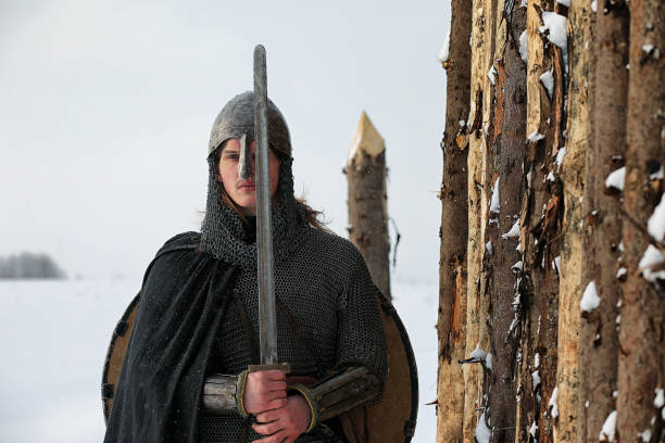istock Defender the young warrior in mail armor armed with a sword 656180778