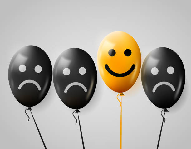 istock One happy face in crowd of sad. Happy and sad balloons. 656184324