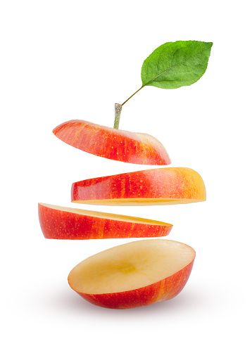 apple slices flying in the air isolated on white background