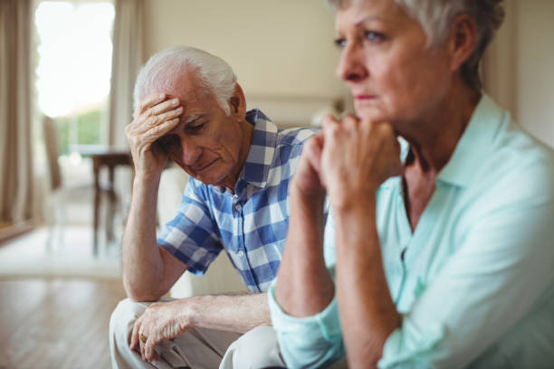 istock Upset senior couple relaxing on sofa 656184736