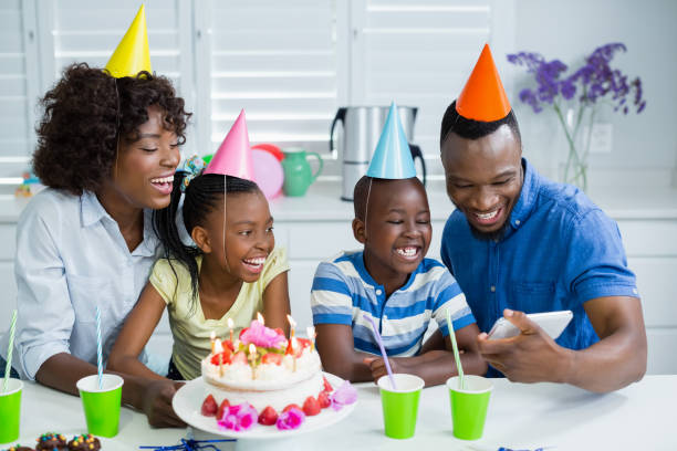 istock Family looking at picture while celebrating birthday party 656189514