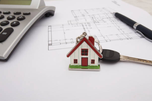 istock Architectural project, calculator, keys and pencil on desk table. Real Estate Concept 656193222