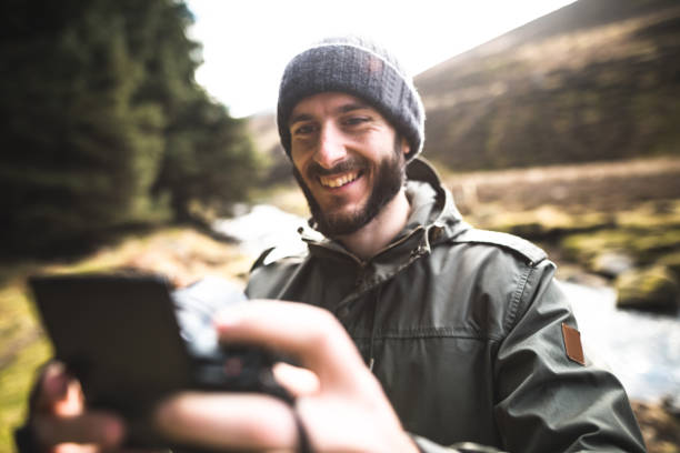 istock photographer hiking in the forest and take a selfie 656193290