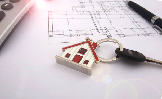 istock Architectural project, calculator, keys and pencil on desk table. Real Estate Conce 656200160