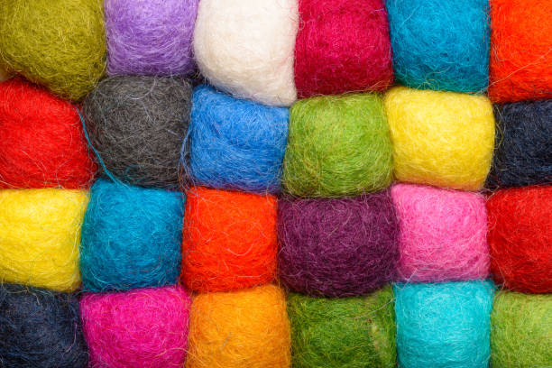 istock color wool background - balls of synthetic wool yarn - geometric rainbow pattern 656203224