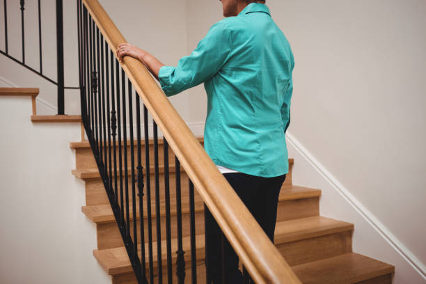 istock Senior woman walking up stairs 656203434