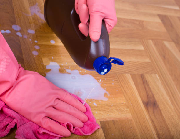 istock Hand with gloves wiping floor 656203574