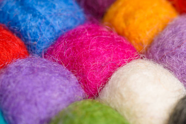 istock color wool background - balls of syntetic wool yarn - geometric rainbow pattern 656203836