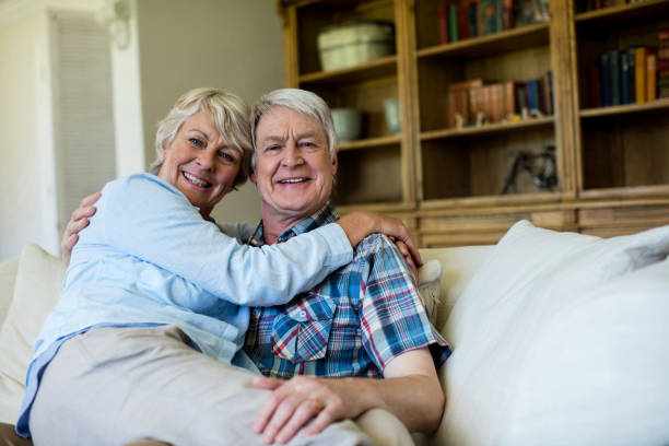 istock Senior couple relaxing on sofa in living room 656204342