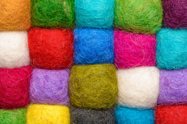 istock color wool background - balls of synthetic wool yarn - geometric rainbow pattern 656204520