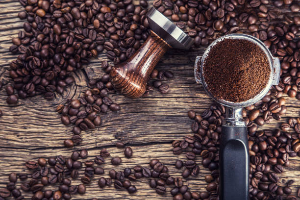 istock Coffee.Coffee beans and portafilter on old oak wooden table 656210362