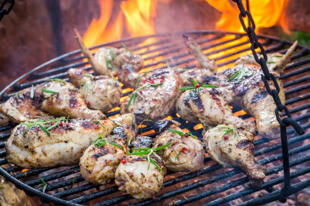 istock Fresh chicken on grill with spices and rosemary 656211576