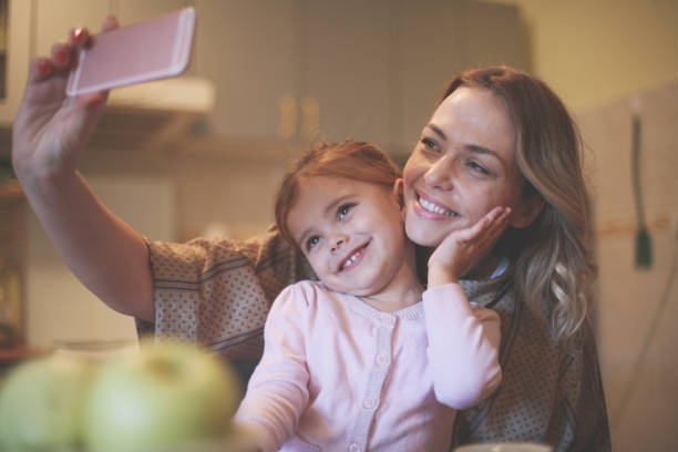 istock Mother with daughter making funny face. 656214258
