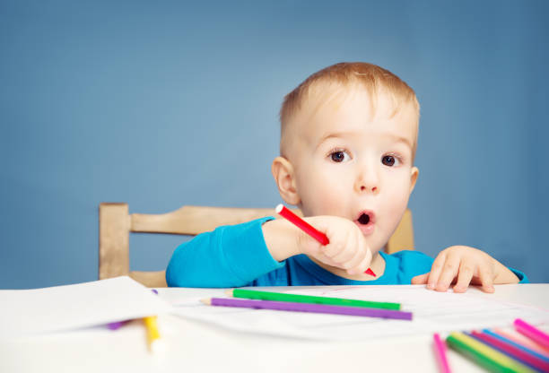istock Little child drawing on the paper 656214762