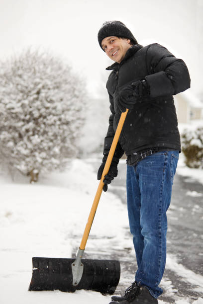 istock Smiling Man Shoveling Snow 656218940