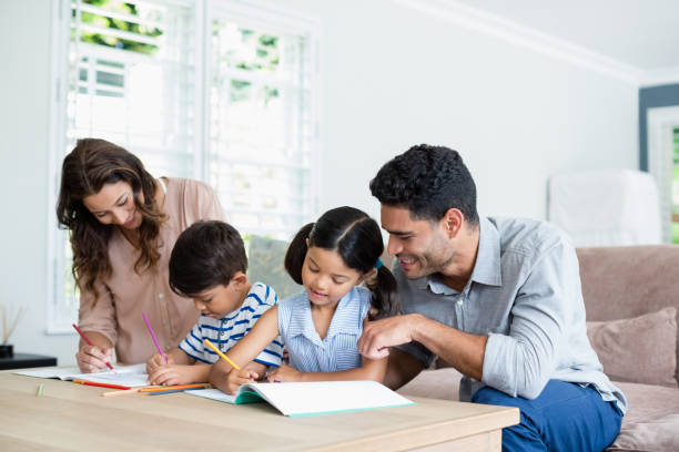 istock Parents assisting their kids in doing homework 656221912
