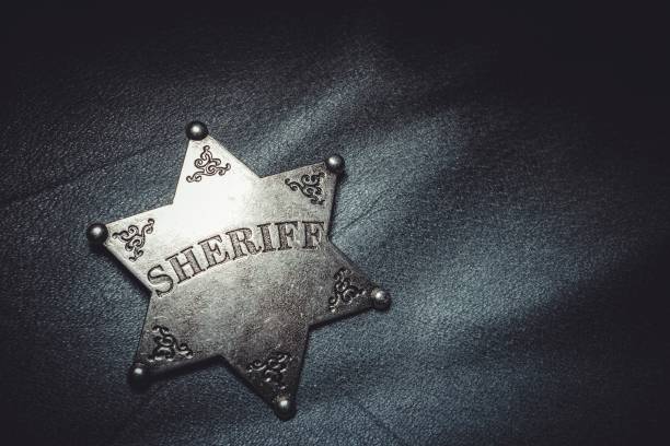 istock Sheriff badge on gray leather texture background. 656234472