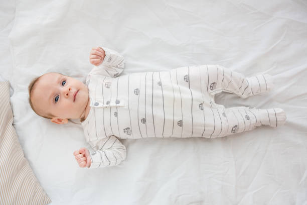 istock Cute baby boy relaxing on bed 656234634