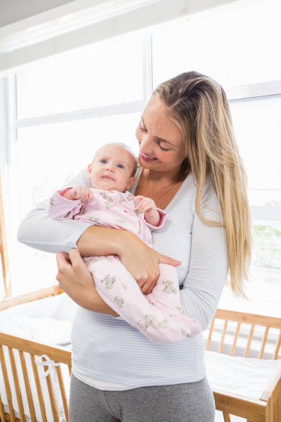 istock Mother holding her baby boy 656234648
