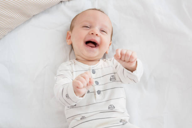 istock Cute baby boy relaxing on bed 656234652