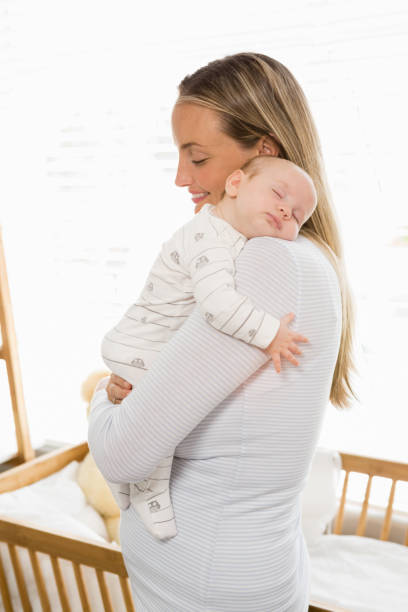 istock Mother holding and embracing her baby boy 656235274