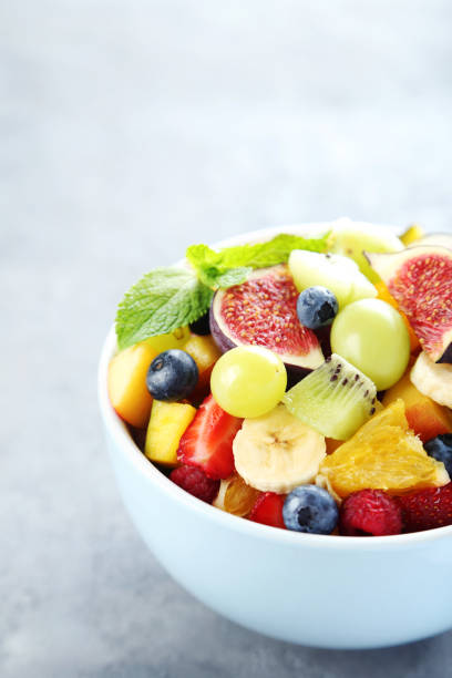 istock Fresh fruit salad on a grey wooden table 656244954