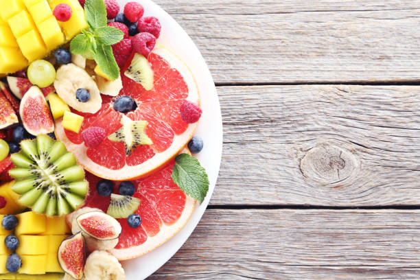 istock Fresh fruit salad on a grey wooden table 656246176