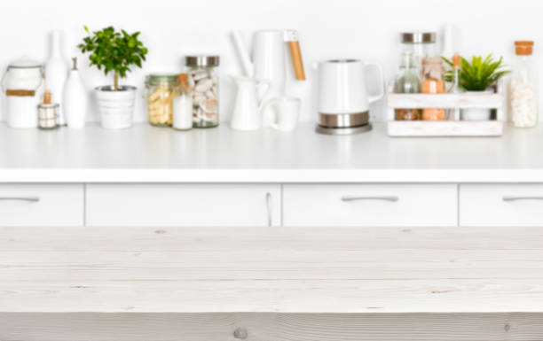 istock Wooden planks table over blurred image of kitchen bench interior 656252202