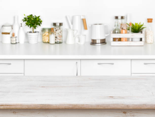 istock Wooden table with bokeh image of different kitchen common products 656252360