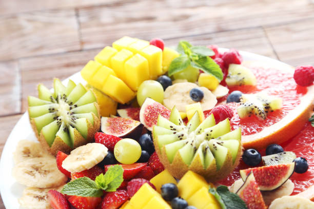 istock Fresh fruit salad on a brown wooden table 656252548