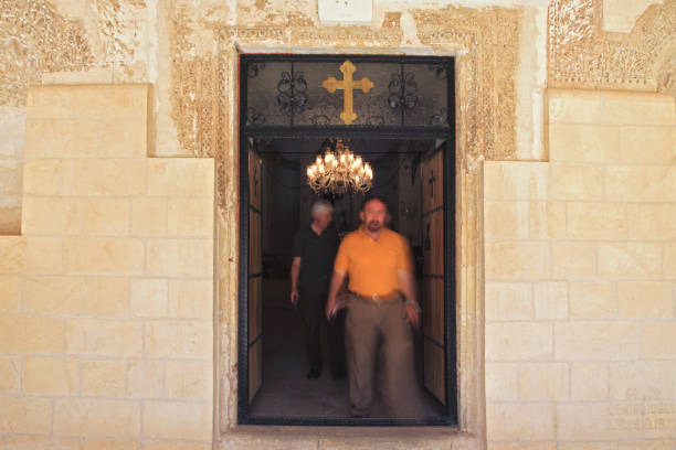 Tourists are visiting the sacred rooms of the monastery. Dayro d-Mor Hananyo is an important Syriac Orthodox monastery. The monastery is located in the Syriac cultural region known as Tur Abdin, and is located three kilometers south east of Mardin, Turkey on November 05, 2012.
