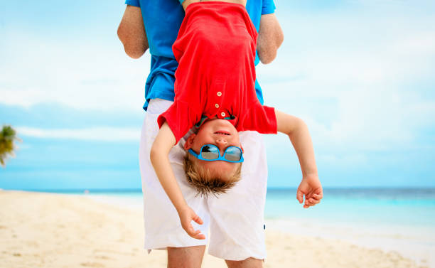istock father and little son playing at sky 656260034