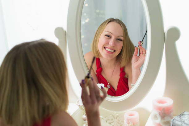istock Young girl look at mirror 656260454