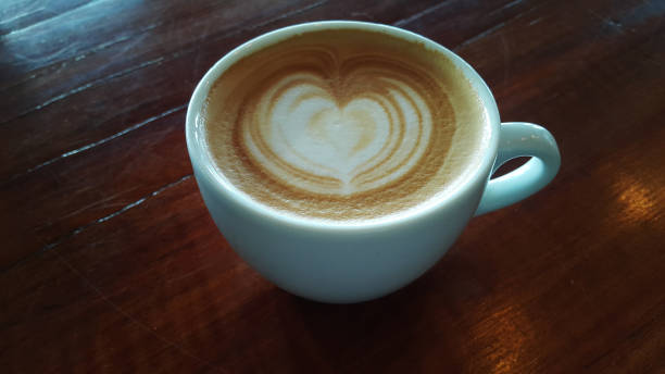istock Hot Latte art on wooden background 656263430