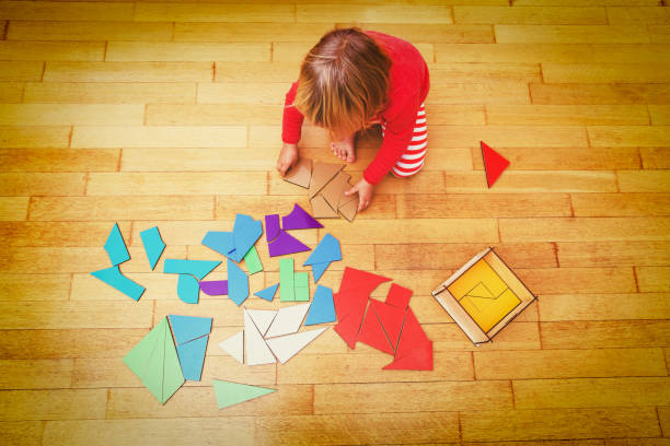istock little girl playing with puzzle, early education 656263992