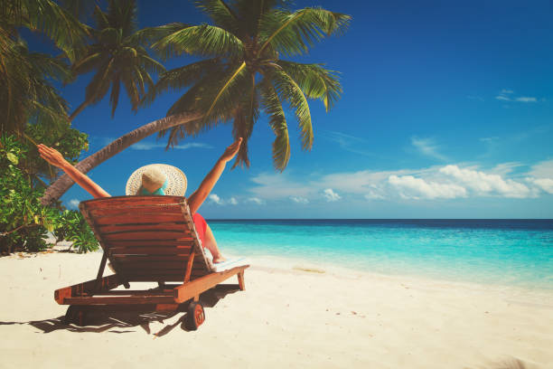 istock happy woman on tropical beach vacation 656264644