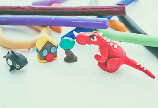 istock Dinosaur, whale, house clay model, on white background. Vintage tone. 656277566
