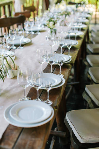 istock Glasses on the festive table setting. Wedding table decor. Table setting in classic style, setout, layout 656278598