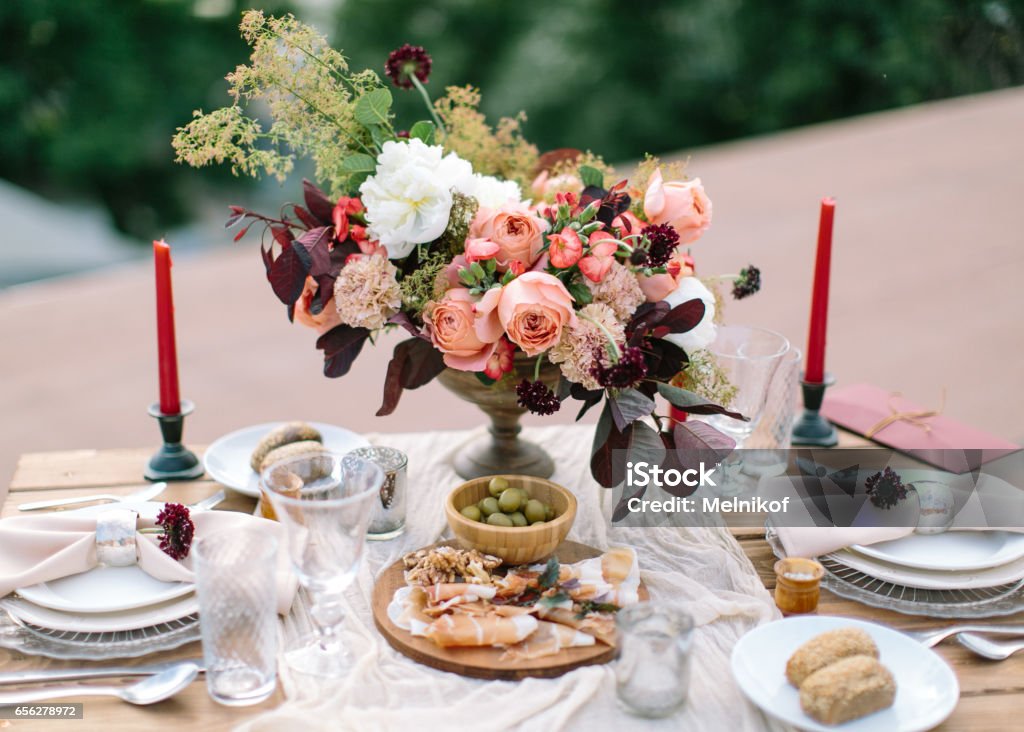 look for pension Choice Wedding Decor Perfectly Decorated Holiday Table For Two With Beautiful  Flower Composition Of Fresh Flowers In A Vintage Vase Red Candles Thinly  Cut Jamon Green Olives And Fresh Bread Stock Photo -