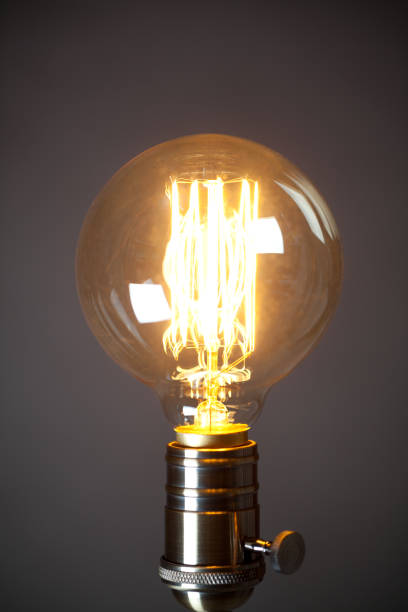 istock Vintage incandescent Edison type bulb on grey background 656279766