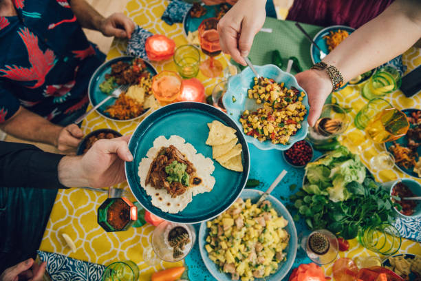 taco mexican tex med food lifestyles with friends eating dinner - mexican dish imagens e fotografias de stock