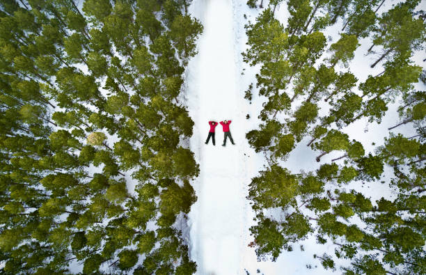 Photo of Aerial view of a couple in the snow