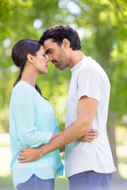 istock Couple embracing each other in park 656286746
