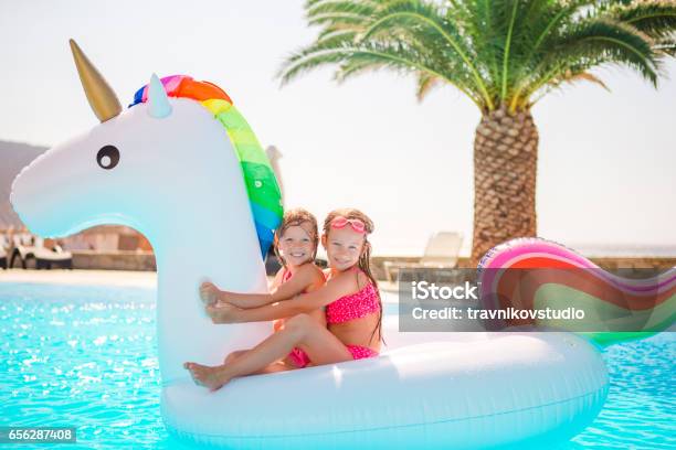 Two Little Kids Playing In The Swimming Pool Stock Photo - Download Image Now - Beach, Child, Humor