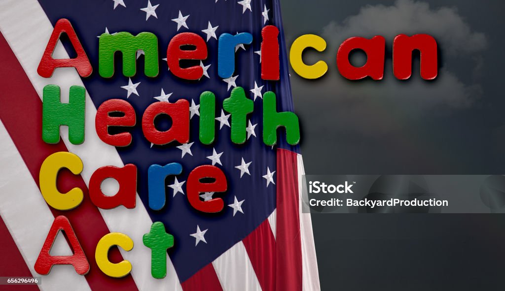 American Health Care Act illustration with US flag Childs magnetic letters spell American Health Care Act in congress. This is superimposed on a US flag with stormy weather and clouds American Flag Stock Photo