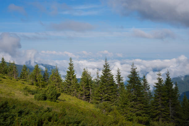istock View at clouds that float over the green mountain valleys 656297550
